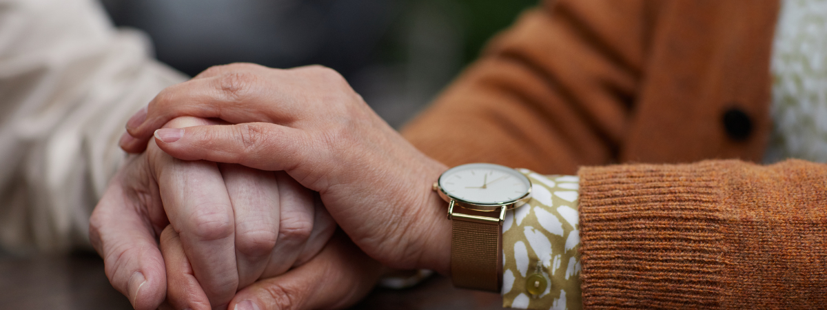 Two people holding hands.