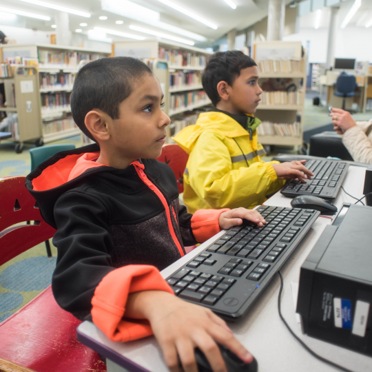 Kids using computers at Main Branch image