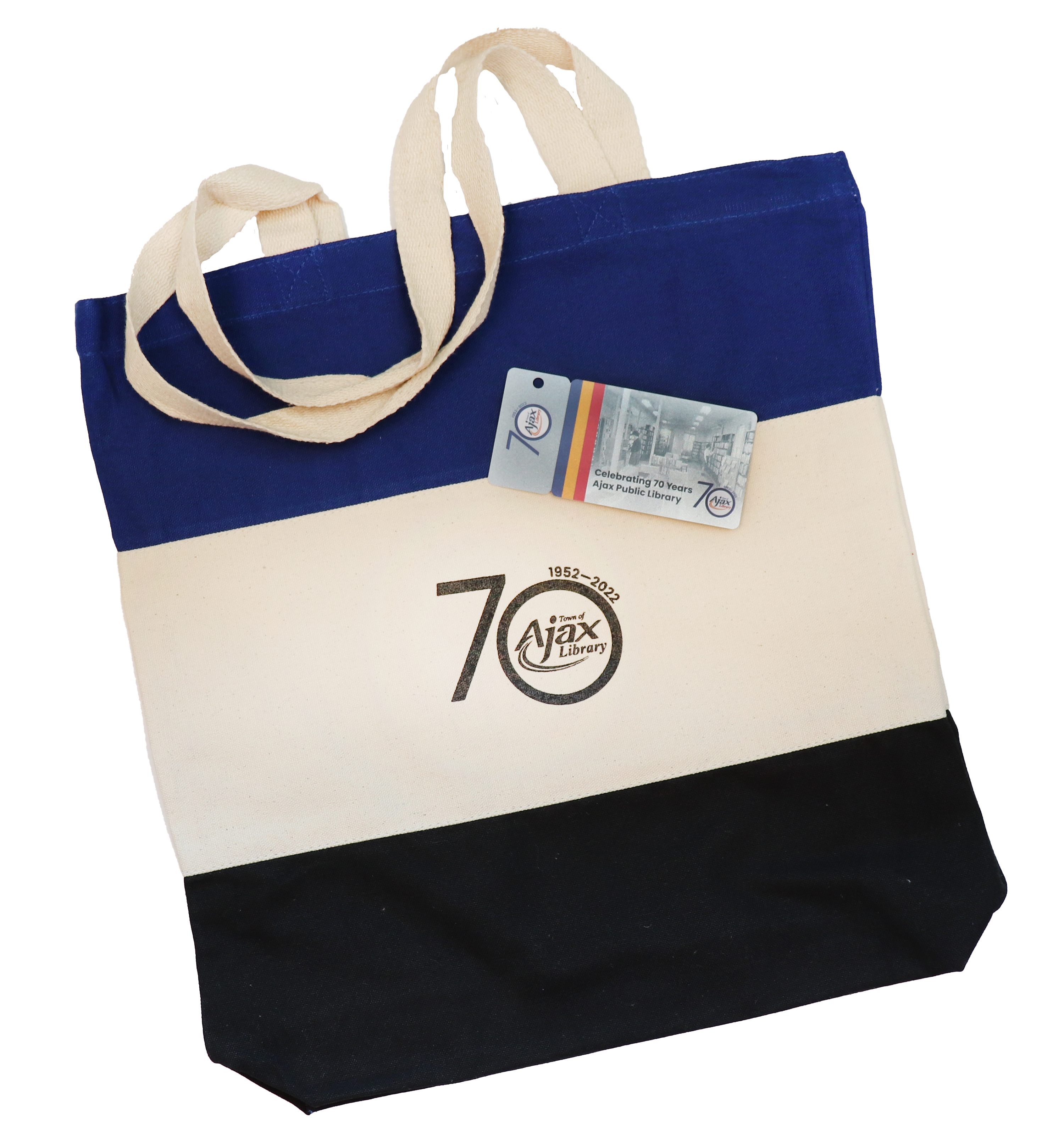 A Library 70th anniversary tote bag with a new Library card on top.