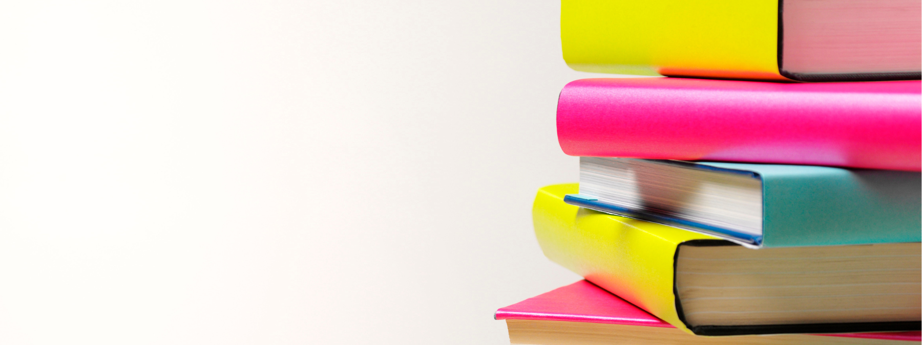 White background with a stack of bright pink, yellow, and teal books on the right side.