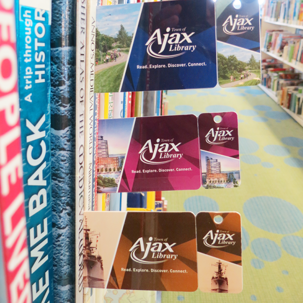 Three different Ajax Public Library cards.